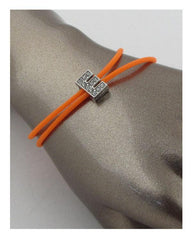 Multi colored rubber bracelets w/charm letters that spell out LOVE | Mixtshop LLC