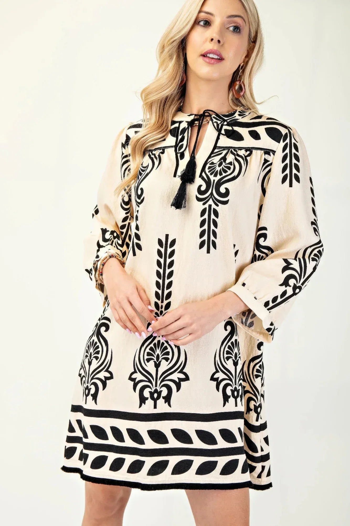 Printed 3/4 Sleeve Dress With Tassel Tie And Fringe Detail On Hem | Mixtshop LLC Main image
