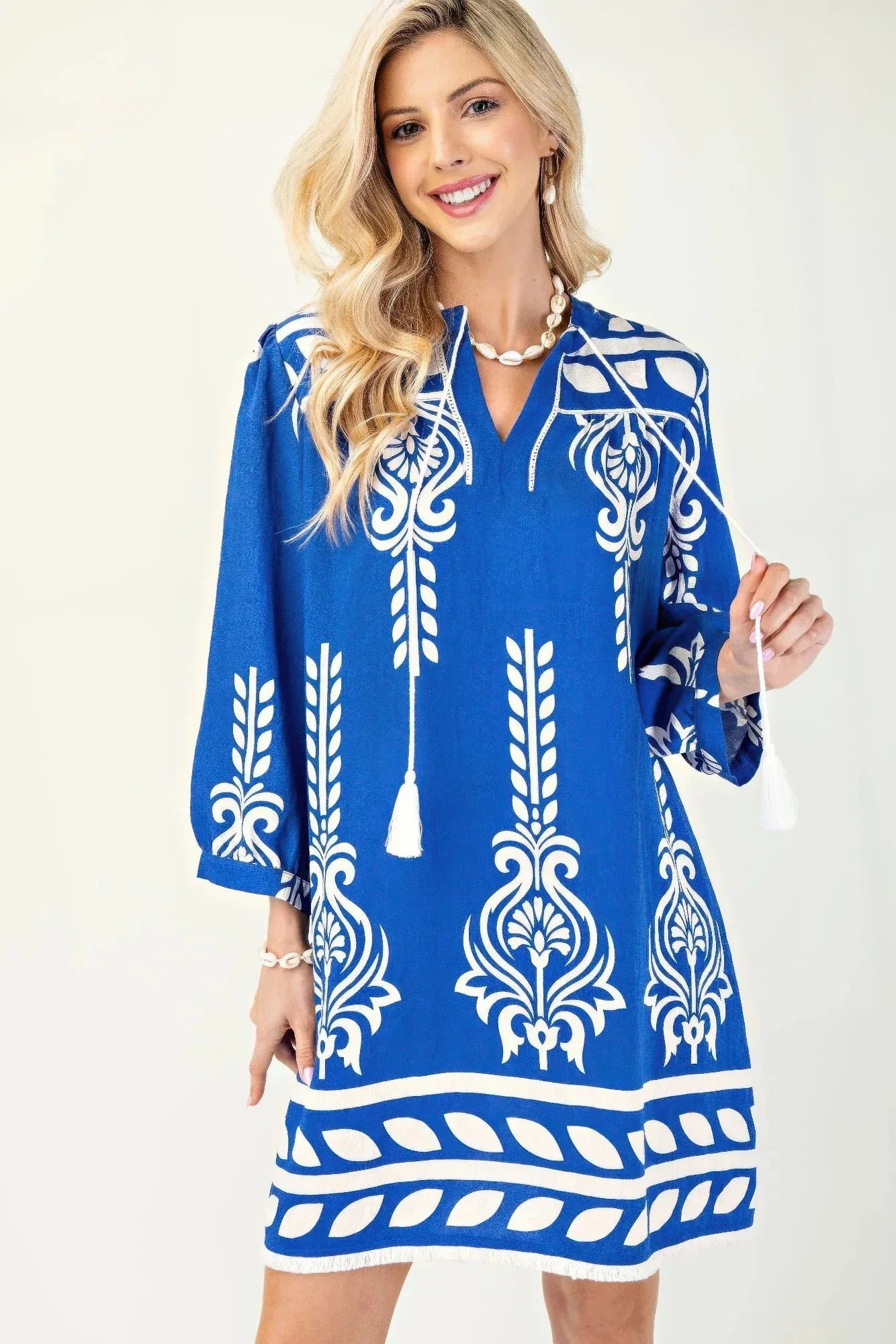 Printed 3/4 Sleeve Dress With Tassel Tie And Fringe Detail On Hem | Mixtshop LLC Main image