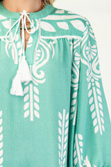 Printed 3/4 Sleeve Dress With Tassel Tie And Fringe Detail On Hem | Mixtshop LLC