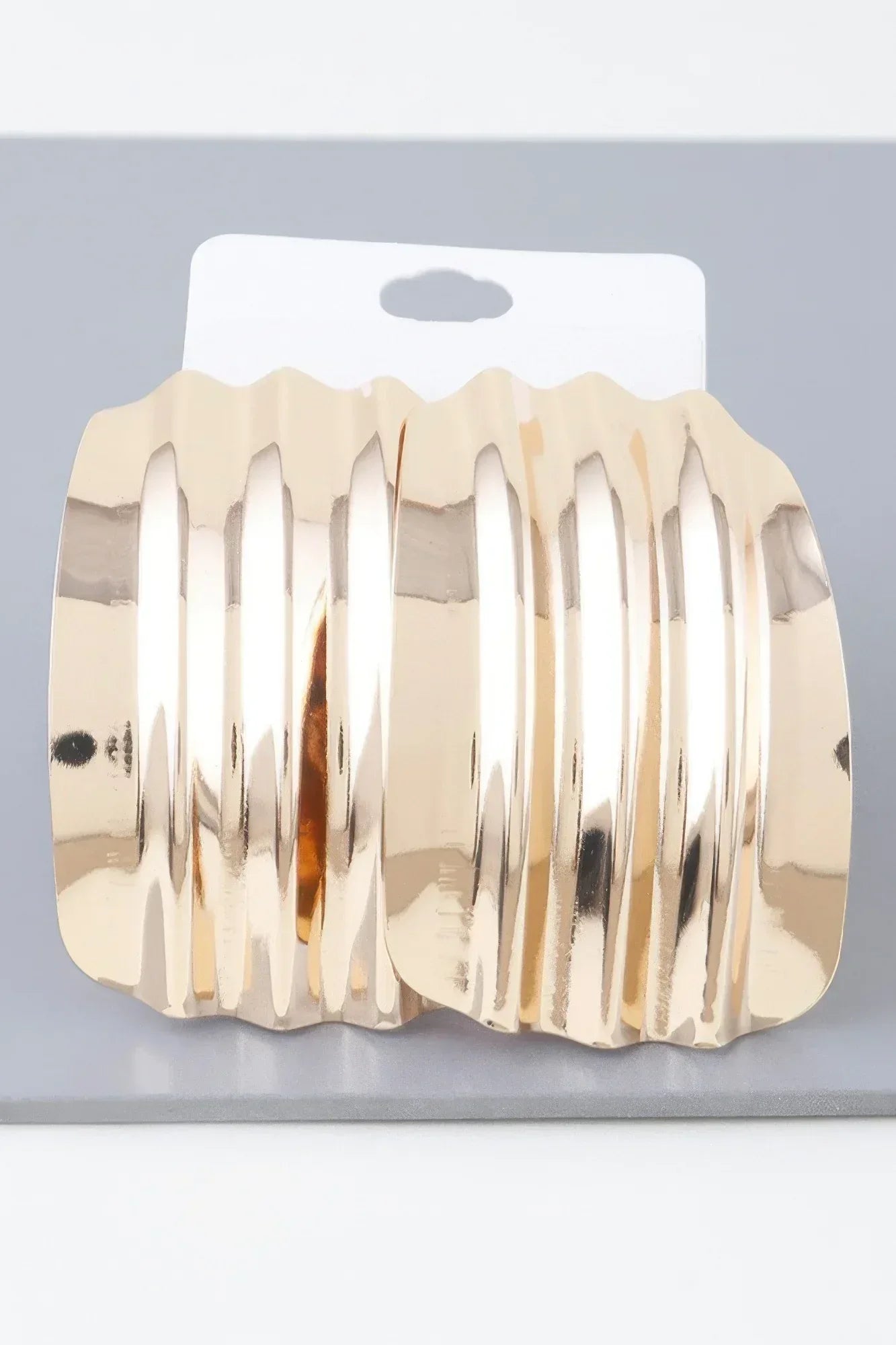 Shiny Ribbed Curve Earrings | Mixtshop LLC Main image