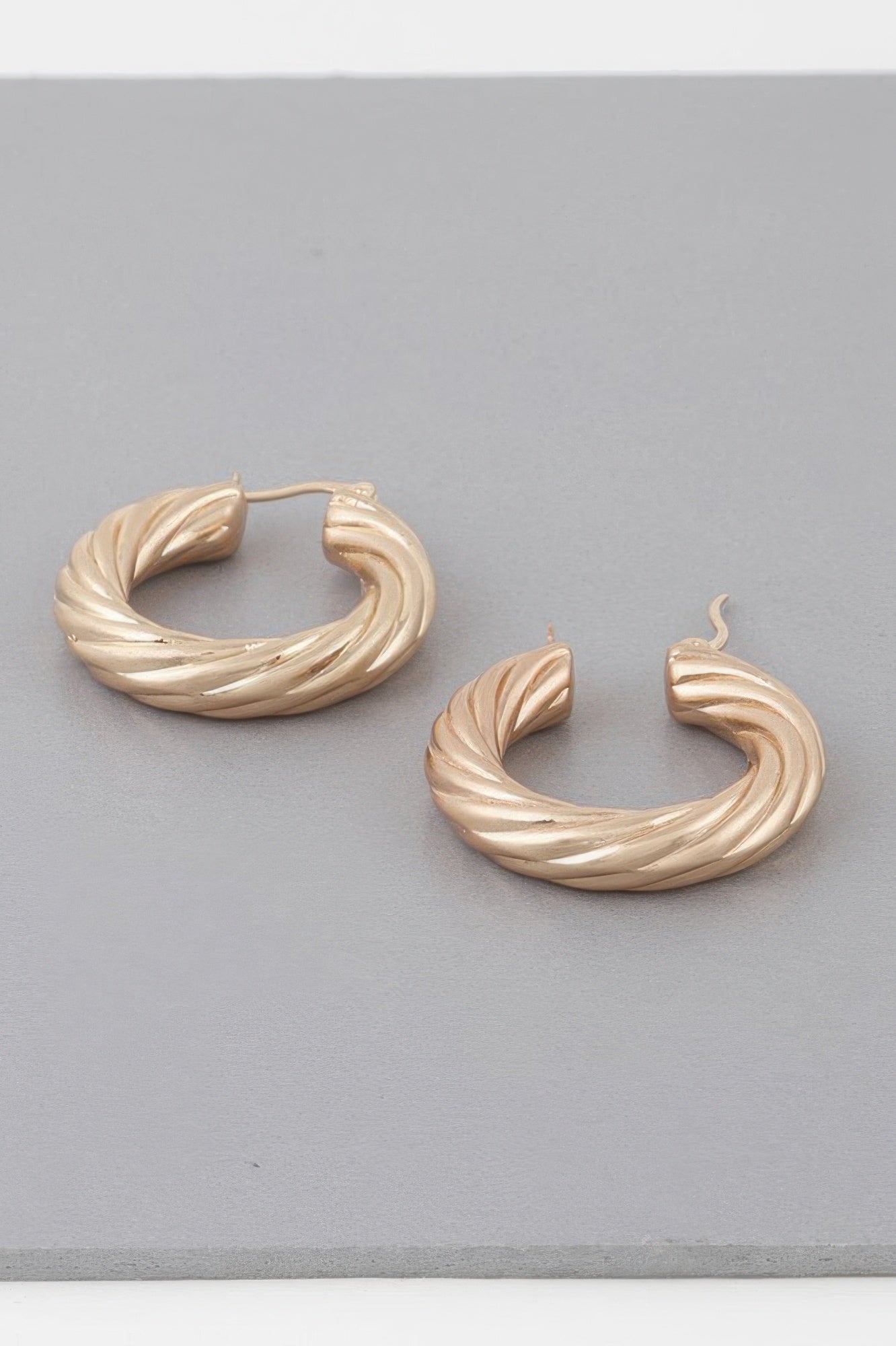 Bulky Twisted Hoop Earrings Secondary image