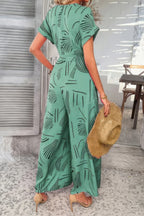Allover Print V Neck Tie Waist Pockets Jumpsuit | Mixtshop LLC