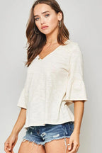 A Knit Top With Deep V Neckline And Yoke Design | Mixtshop LLC